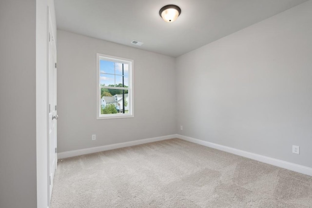 spare room featuring carpet floors