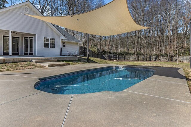 view of pool featuring a patio area, a fenced backyard, ceiling fan, and a fenced in pool