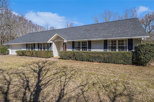 single story home with an attached garage, roof with shingles, and a front yard