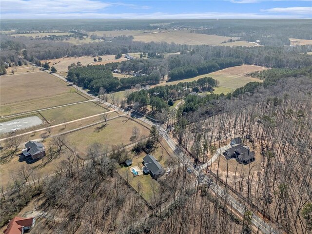 birds eye view of property featuring a rural view