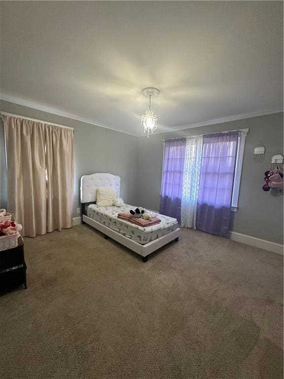 carpeted bedroom featuring an inviting chandelier and crown molding