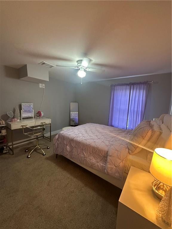 bedroom with ceiling fan and carpet floors