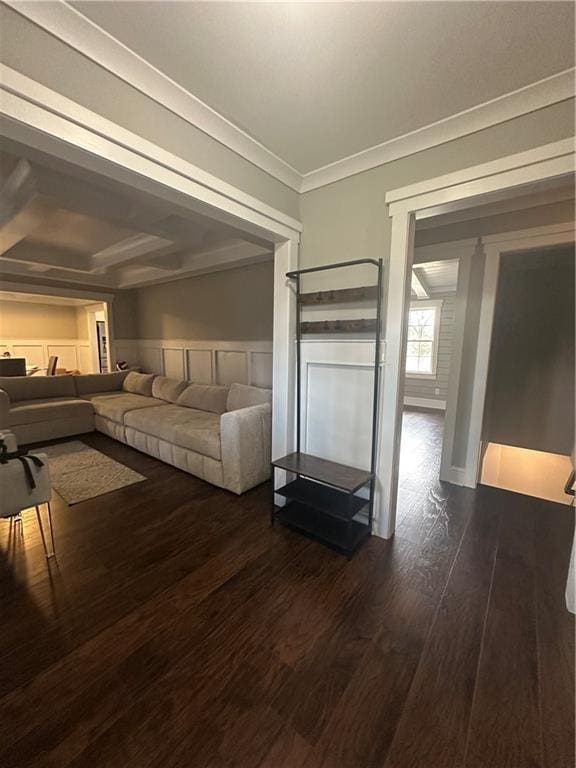 interior space featuring dark wood-type flooring and ornamental molding