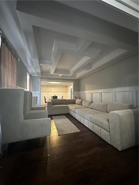 living room with wood-type flooring, coffered ceiling, and beam ceiling