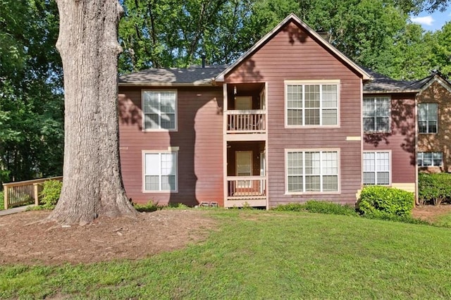 5555 Mountain Springs Cir, Stone Mountain, GA 30088 - view of front of home with a front yard and a balcony