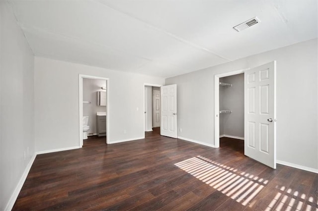 5555 Mountain Springs Cir, Stone Mountain, GA 30088 - unfurnished bedroom with wood finished floors and baseboards