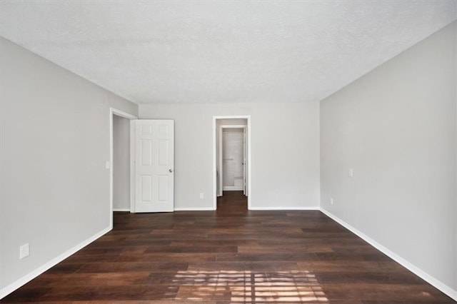 5555 Mountain Springs Cir, Stone Mountain, GA 30088 - unfurnished room featuring wood finished floors, a textured ceiling, and baseboards