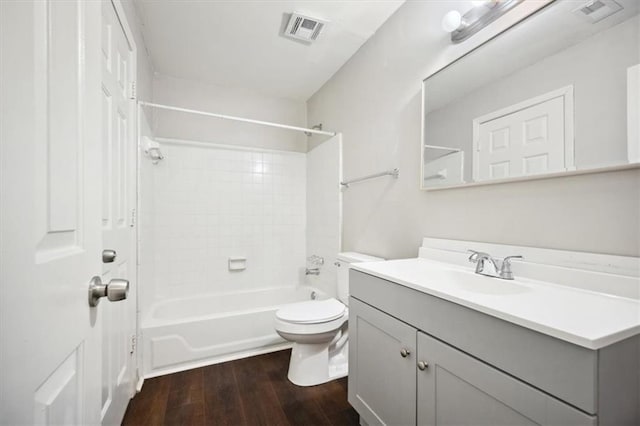 5555 Mountain Springs Cir, Stone Mountain, GA 30088 - full bathroom with wood finished floors, toilet, vanity, and tub / shower combination