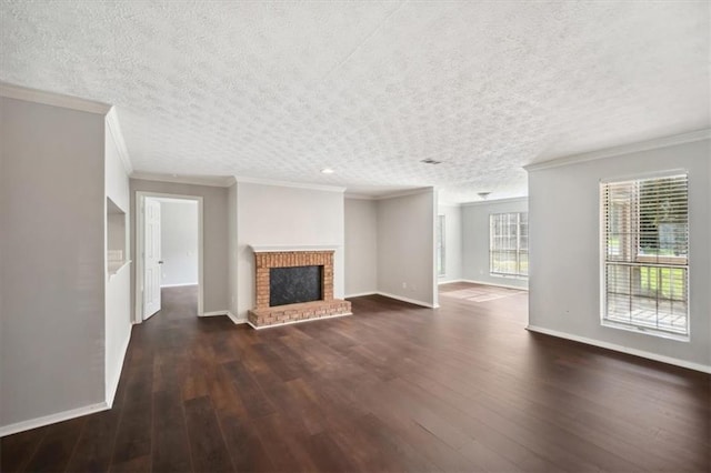 5555 Mountain Springs Cir, Stone Mountain, GA 30088 - unfurnished living room featuring crown molding, dark wood-style flooring, baseboards, a brick fireplace, and a textured ceiling