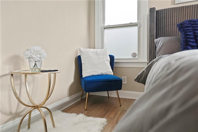 sitting room with wood finished floors and baseboards