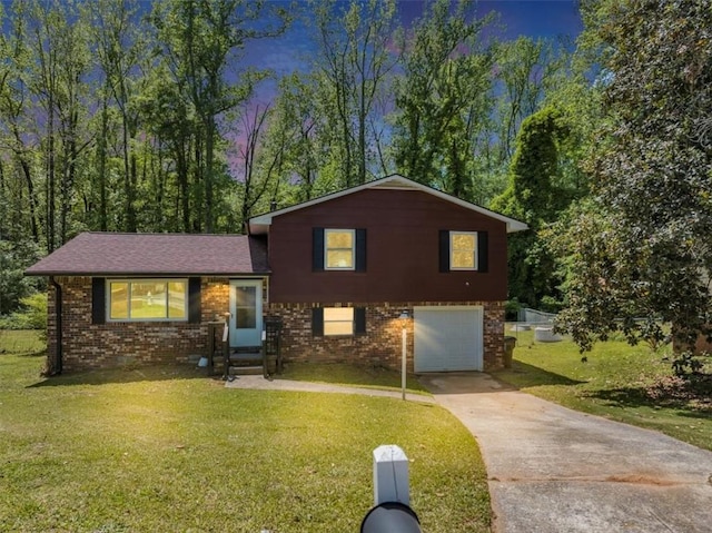 7371 Ovis Ct, Riverdale, GA 30274 - split level home with driveway, a garage, brick siding, entry steps, and a front yard