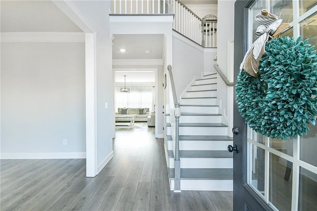 dining room featuring stairway, plenty of natural light, and beam ceiling