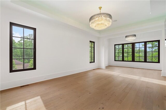 room details with hardwood / wood-style flooring, a chandelier, and beamed ceiling