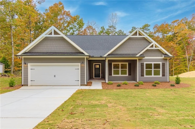 craftsman-style home with a front lawn and a garage