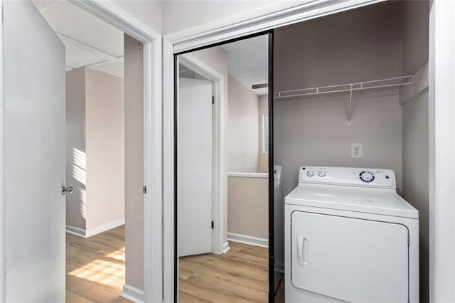 washroom with light wood-type flooring and washer / clothes dryer