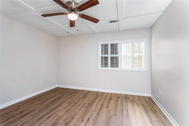 unfurnished room with ceiling fan, wood-type flooring, and coffered ceiling