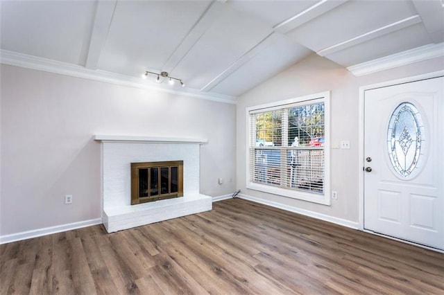 unfurnished living room featuring vaulted ceiling, a fireplace, and hardwood / wood-style flooring