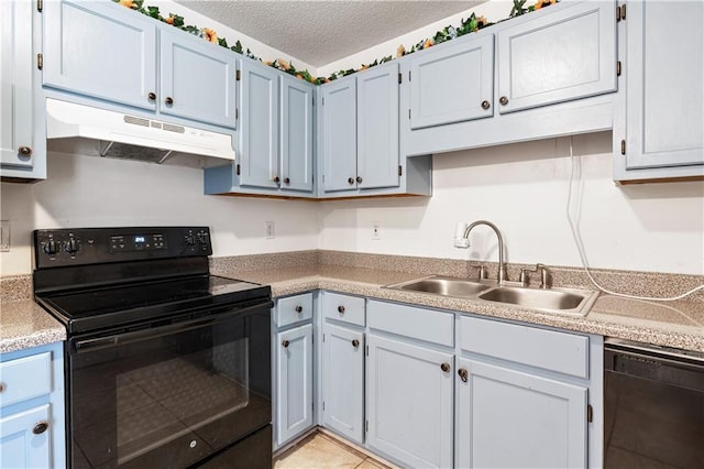 kitchen with light countertops, a sink, a textured ceiling, under cabinet range hood, and black appliances