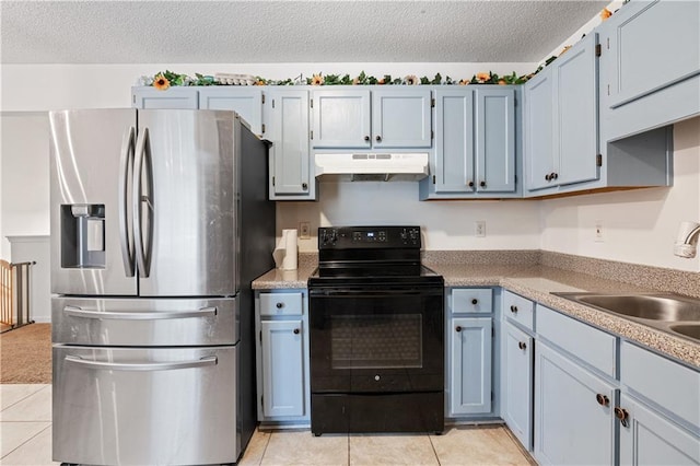 kitchen featuring a textured ceiling, light tile patterned flooring, under cabinet range hood, stainless steel fridge with ice dispenser, and black electric range oven