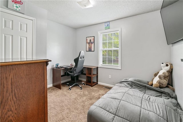 bedroom with carpet floors, a textured ceiling, and baseboards