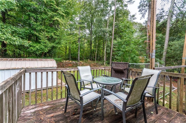 wooden deck featuring outdoor dining area