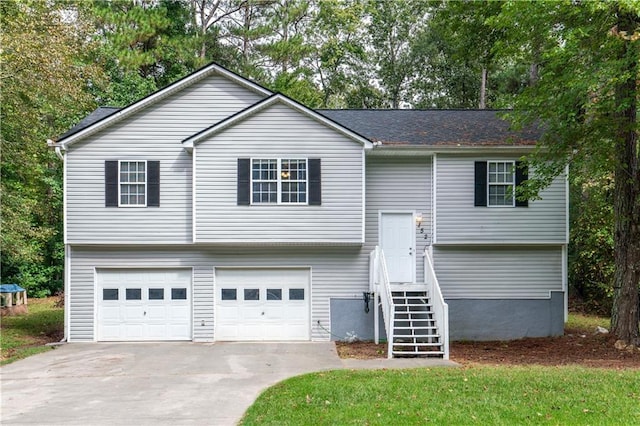 bi-level home featuring driveway and an attached garage