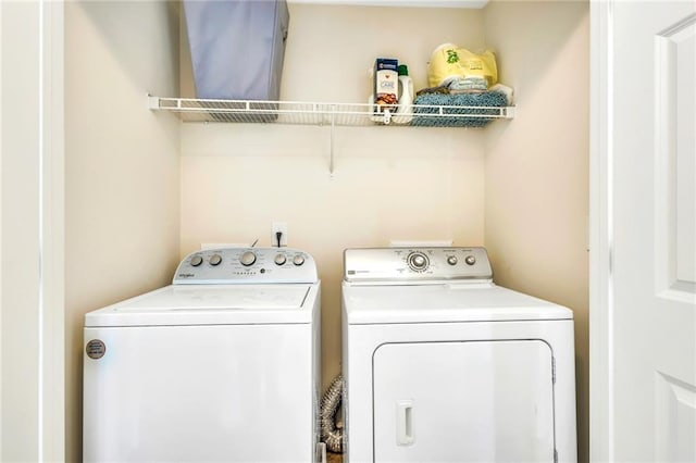 washroom featuring washer and dryer