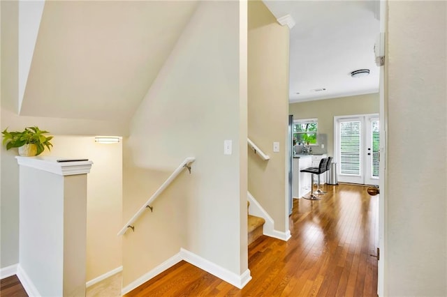 stairs with hardwood / wood-style floors