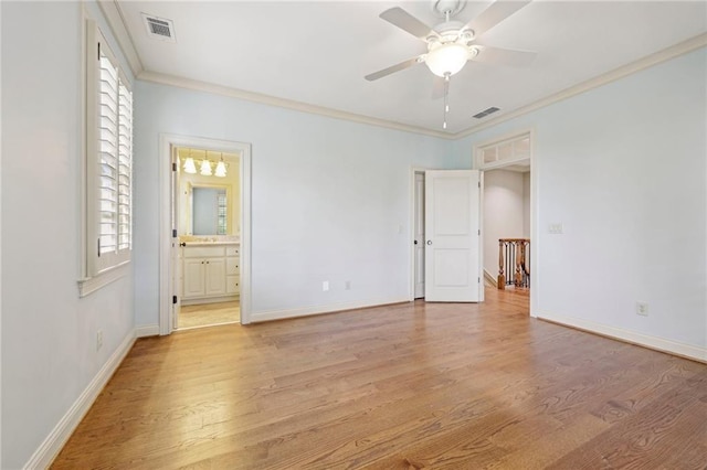 unfurnished bedroom with ceiling fan, crown molding, light wood-type flooring, and ensuite bath