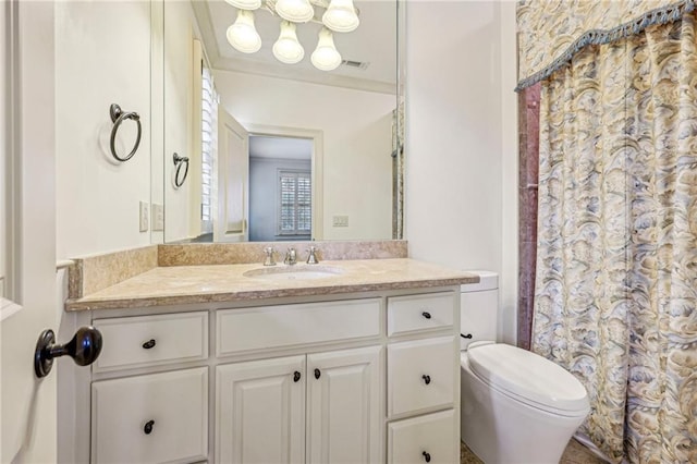 bathroom with vanity and toilet