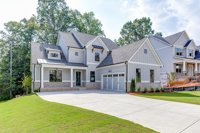 view of front of house featuring a garage, a front lawn, and a porch