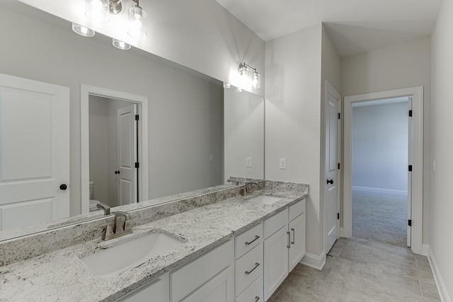 bathroom with vanity and toilet