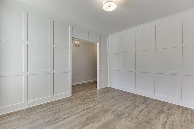 unfurnished room with light wood-type flooring