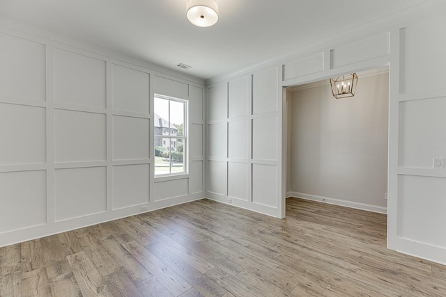 empty room with light hardwood / wood-style floors