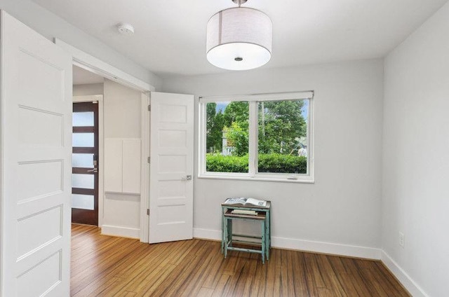 1672 Dekalb Ave NE Unit 2, Atlanta, GA 30307 - spare room with wood finished floors, baseboards, and a smoke detector