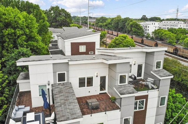 1672 Dekalb Ave NE Unit 2, Atlanta, GA 30307 - view of front of property featuring a patio, fence, and stucco siding