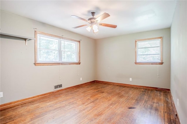 2201 Bollingbrook Dr, Atlanta, GA 30311 - spare room with light wood-type flooring, ceiling fan, and baseboards