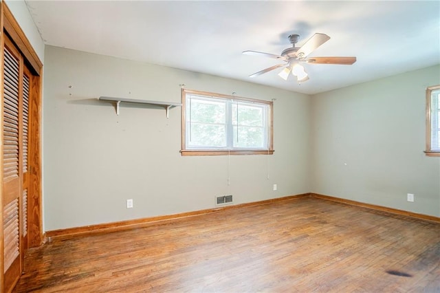 2201 Bollingbrook Dr, Atlanta, GA 30311 - unfurnished bedroom with wood finished floors, baseboards, a closet, and ceiling fan