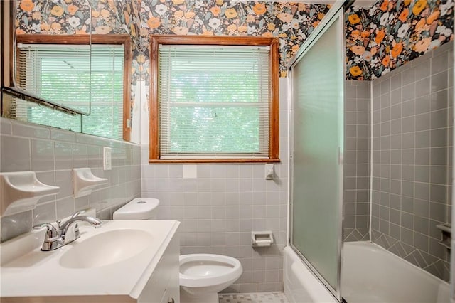 2201 Bollingbrook Dr, Atlanta, GA 30311 - full bath with toilet, vanity, combined bath / shower with glass door, wallpapered walls, and tile walls