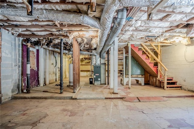 2201 Bollingbrook Dr, Atlanta, GA 30311 - unfinished below grade area with heating unit, stairs, and gas water heater