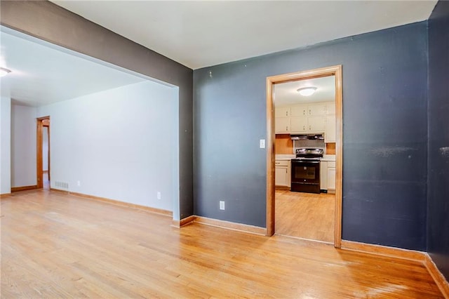 2201 Bollingbrook Dr, Atlanta, GA 30311 - empty room with light wood finished floors and baseboards