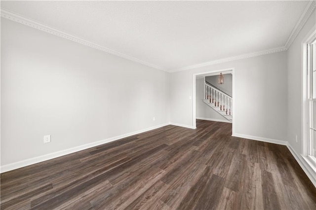5659 Brookstone Dr NW, Acworth, GA 30101 - spare room featuring dark wood finished floors, baseboards, stairway, and ornamental molding