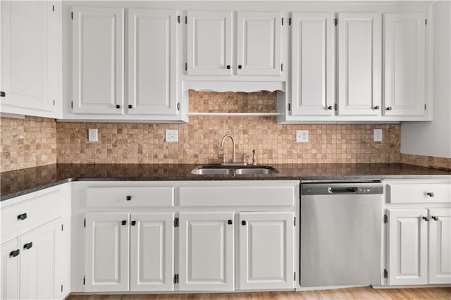 5659 Brookstone Dr NW, Acworth, GA 30101 - kitchen featuring dishwasher, a sink, white cabinetry, dark stone countertops, and decorative backsplash