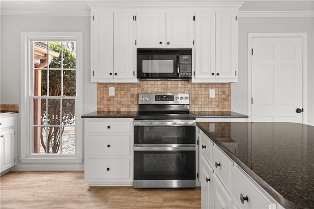 5659 Brookstone Dr NW, Acworth, GA 30101 - kitchen featuring black microwave, range with two ovens, light wood finished floors, white cabinetry, and crown molding