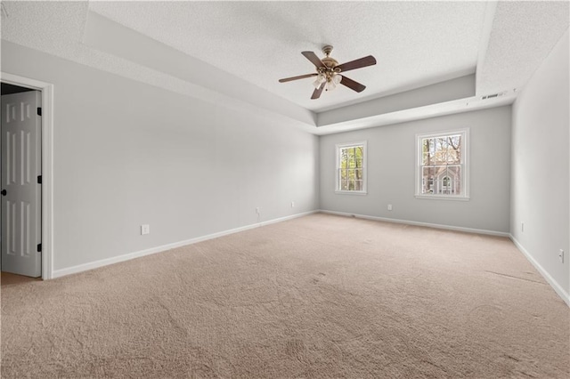 5659 Brookstone Dr NW, Acworth, GA 30101 - carpeted spare room with a textured ceiling, a tray ceiling, ceiling fan, and baseboards