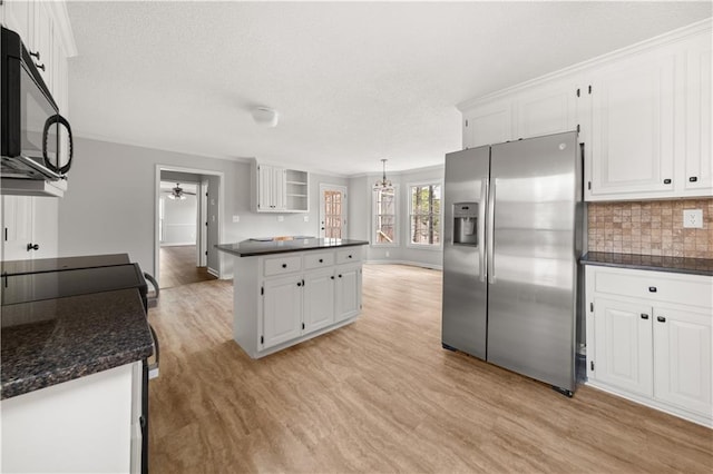 5659 Brookstone Dr NW, Acworth, GA 30101 - kitchen with stainless steel fridge, light wood-style floors, white cabinets, ceiling fan, and a textured ceiling