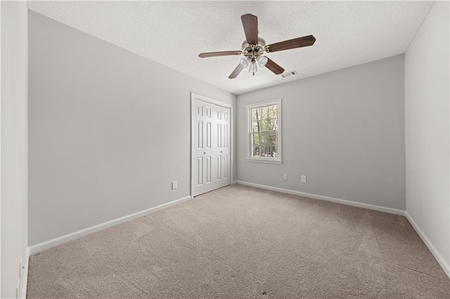5659 Brookstone Dr NW, Acworth, GA 30101 - empty room featuring carpet, baseboards, ceiling fan, and a textured ceiling