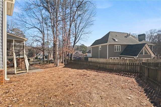 5659 Brookstone Dr NW, Acworth, GA 30101 - fenced backyard featuring a sunroom and stairs