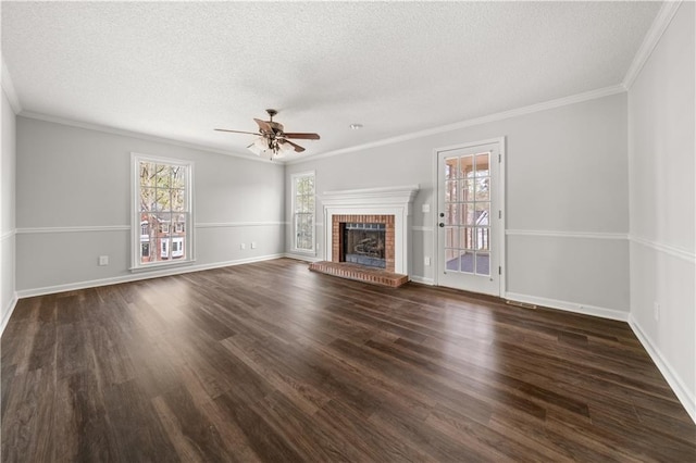 5659 Brookstone Dr NW, Acworth, GA 30101 - unfurnished living room featuring a textured ceiling, ceiling fan, wood finished floors, ornamental molding, and baseboards
