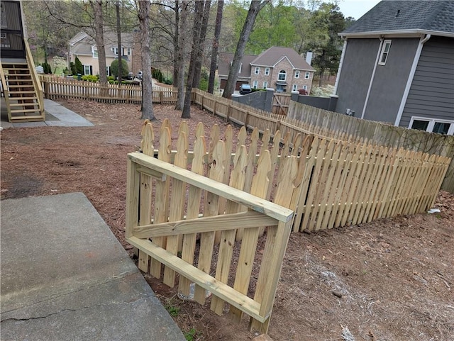 5659 Brookstone Dr NW, Acworth, GA 30101 - fenced backyard featuring a residential view and stairway